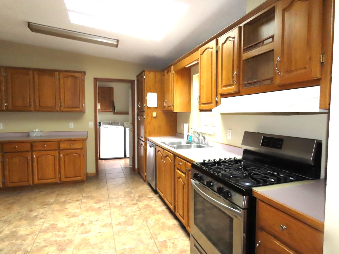 2968 North 2659th Road Seneca, IL 61360 - Photo 2 of 20 a kitchen with granite countertop a stove and a sink