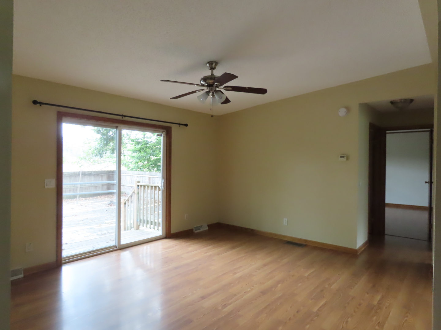 2968 North 2659th Road Seneca, IL 61360 - Photo 5 of 20 wooden floor in an empty room with a window