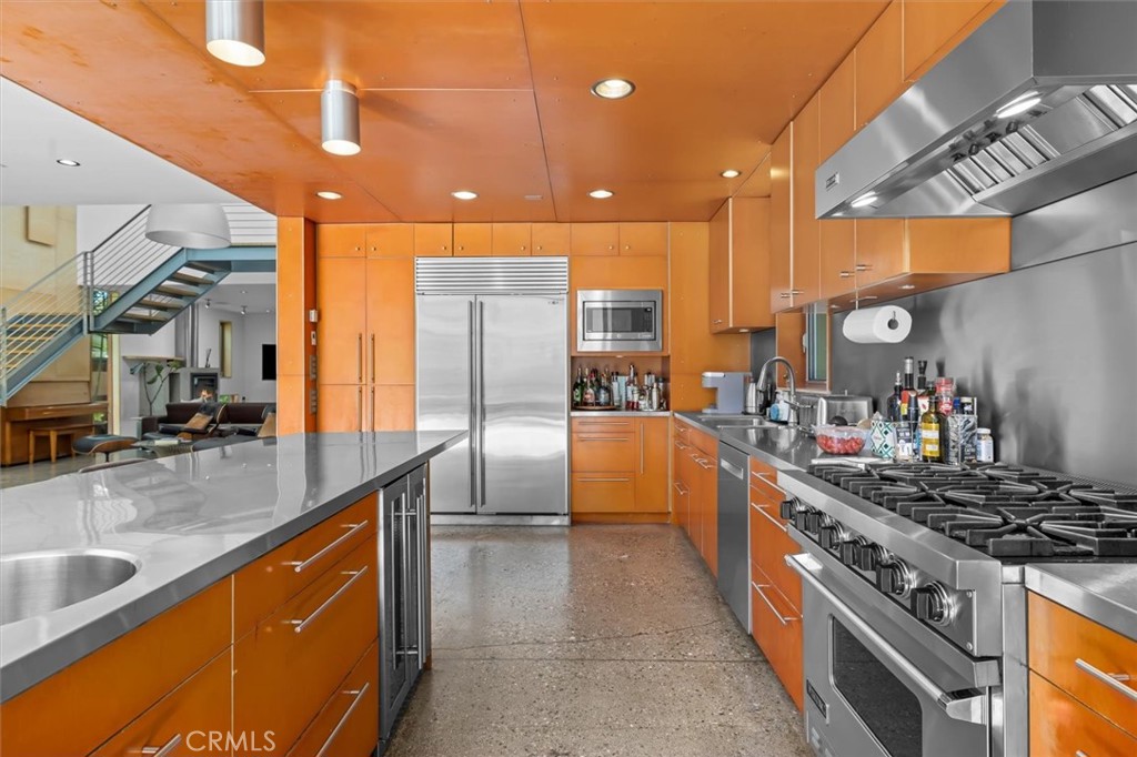 604 33rd Street Manhattan Beach, CA 90266 - Photo 12 of 46 a kitchen with stainless steel appliances granite countertop a sink a stove and a refrigerator
