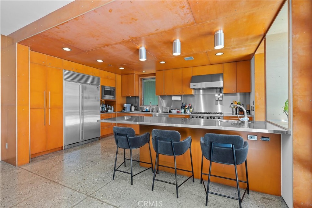 604 33rd Street Manhattan Beach, CA 90266 - Photo 14 of 46 a kitchen with stainless steel appliances granite countertop a sink and a refrigerator