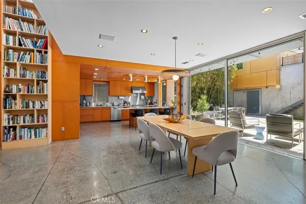 a large kitchen with a table and chairs
