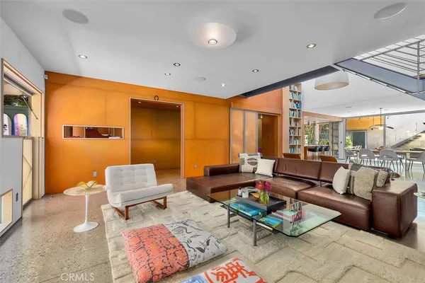 a living room with furniture and a rug