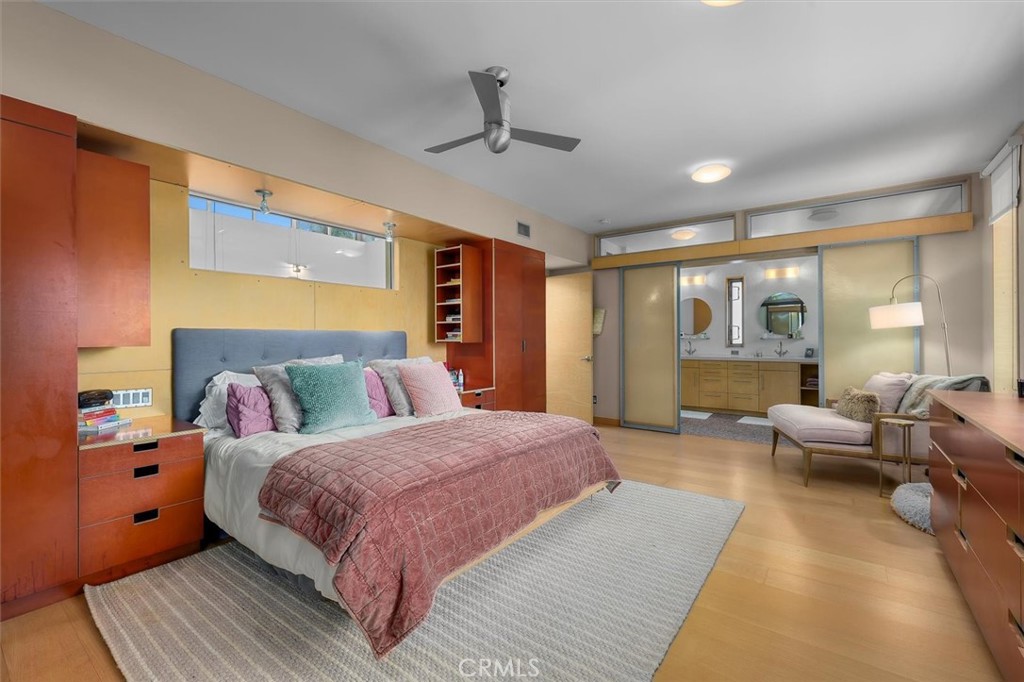 604 33rd Street Manhattan Beach, CA 90266 - Photo 23 of 46 a spacious bedroom with a large bed and a couch