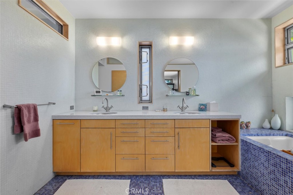 604 33rd Street Manhattan Beach, CA 90266 - Photo 25 of 46 a bathroom with a sink and a mirror