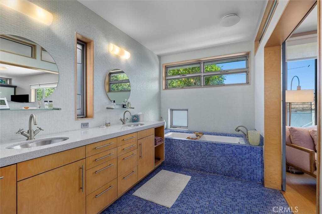 604 33rd Street Manhattan Beach, CA 90266 - Photo 27 of 46 a spacious bathroom with a mirror sink and toilet