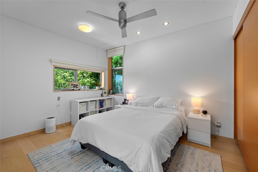 604 33rd Street Manhattan Beach, CA 90266 - Photo 30 of 46 a bedroom with a bed and a flat screen tv