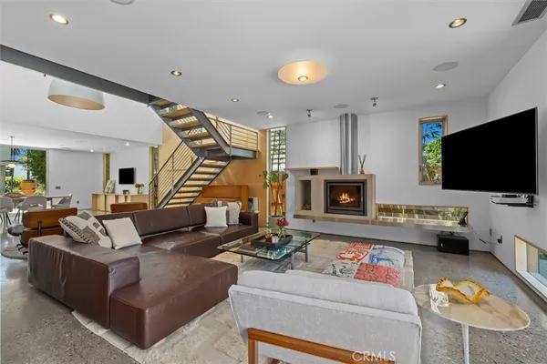 a living room with furniture and a flat screen tv