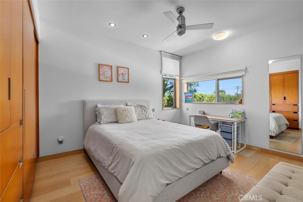 604 33rd Street Manhattan Beach, CA 90266 - Photo 31 of 46 a bedroom with a large bed and a chandelier