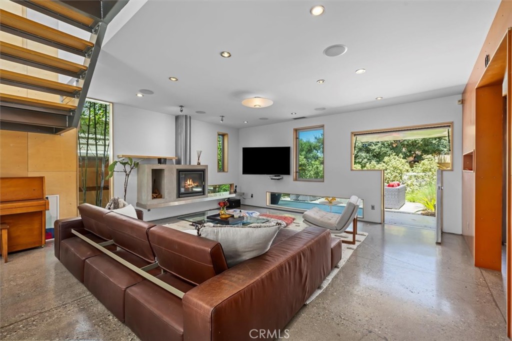 604 33rd Street Manhattan Beach, CA 90266 - Photo 4 of 46 a living room with furniture and a flat screen tv