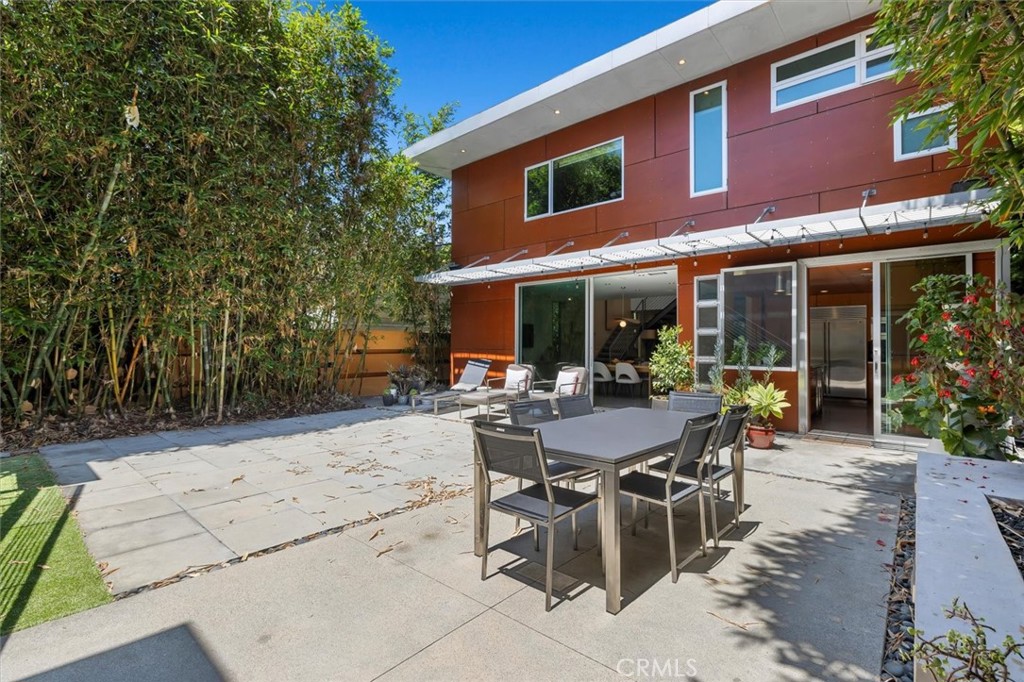 604 33rd Street Manhattan Beach, CA 90266 - Photo 42 of 46 a view of a table and chairs in patio of the house