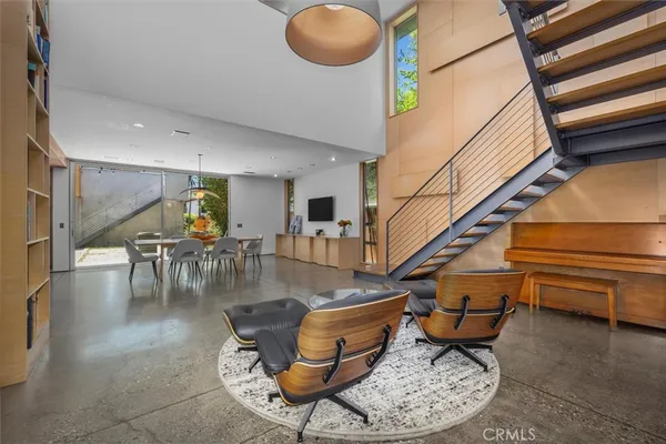 a room with lots of chairs and a table