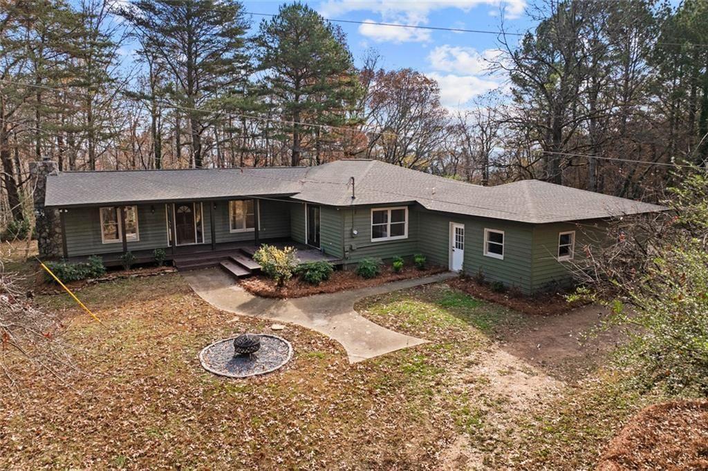 345 Roland Drive Canton, GA 30114 - Photo 2 of 44 a view of a house with backyard and sitting area
