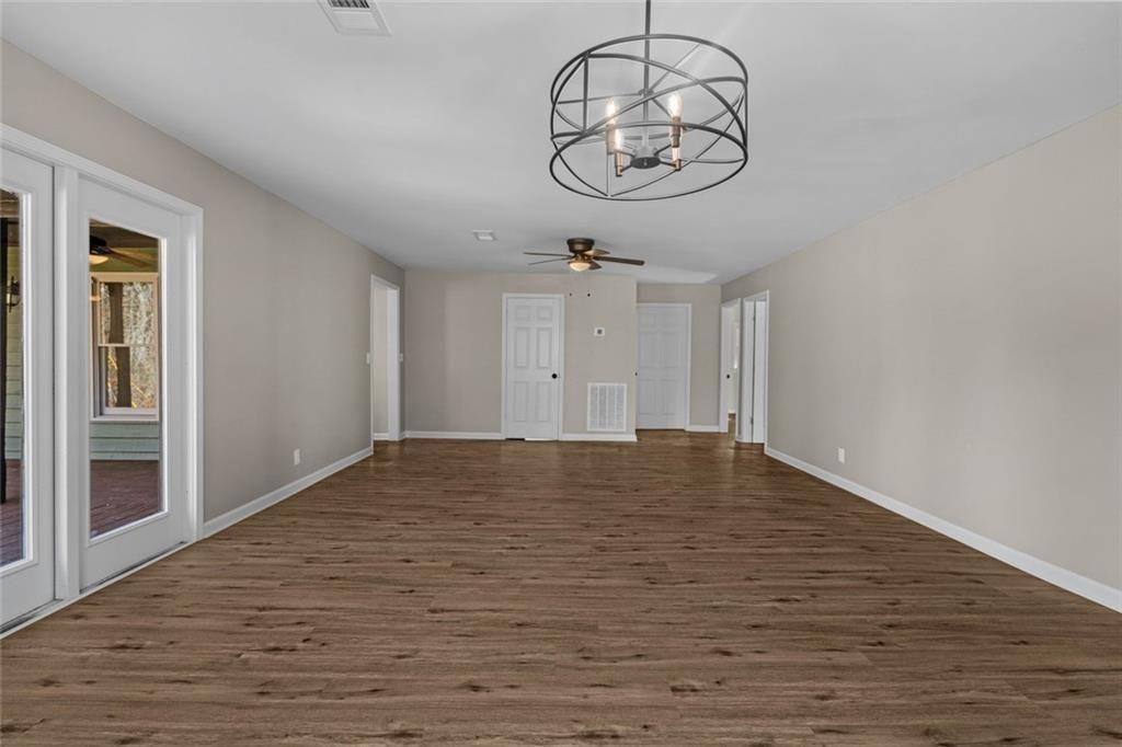 345 Roland Drive Canton, GA 30114 - Photo 22 of 44 a view of empty room with wooden floor and window