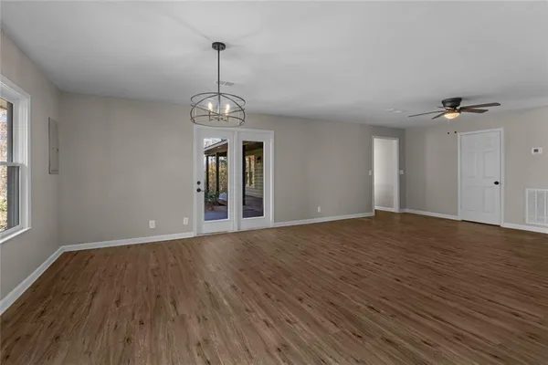 a kitchen with stainless steel appliances granite countertop a stove and a wooden cabinets