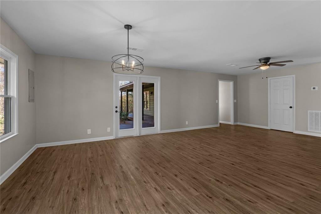 345 Roland Drive Canton, GA 30114 - Photo 26 of 44 a view of an empty room with wooden floor and a window