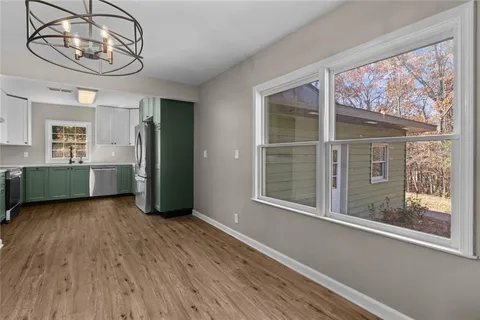 a kitchen with stainless steel appliances a refrigerator and a sink