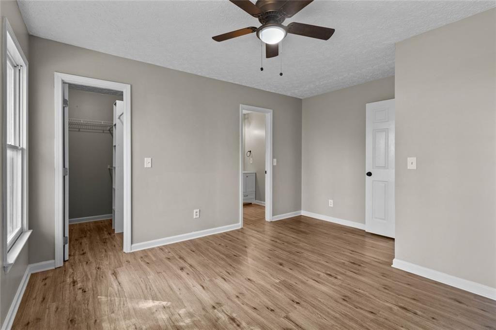 345 Roland Drive Canton, GA 30114 - Photo 35 of 44 wooden floor in an empty room with a window