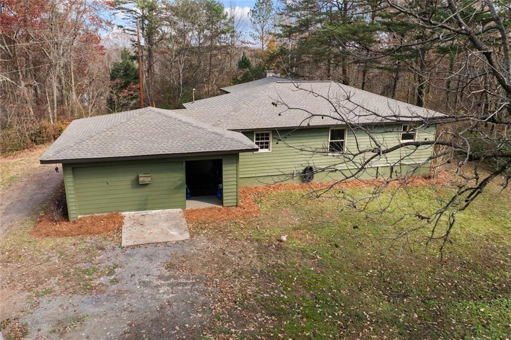 345 Roland Drive Canton, GA 30114 - Photo 7 of 44 an aerial view of a house with yard and parking