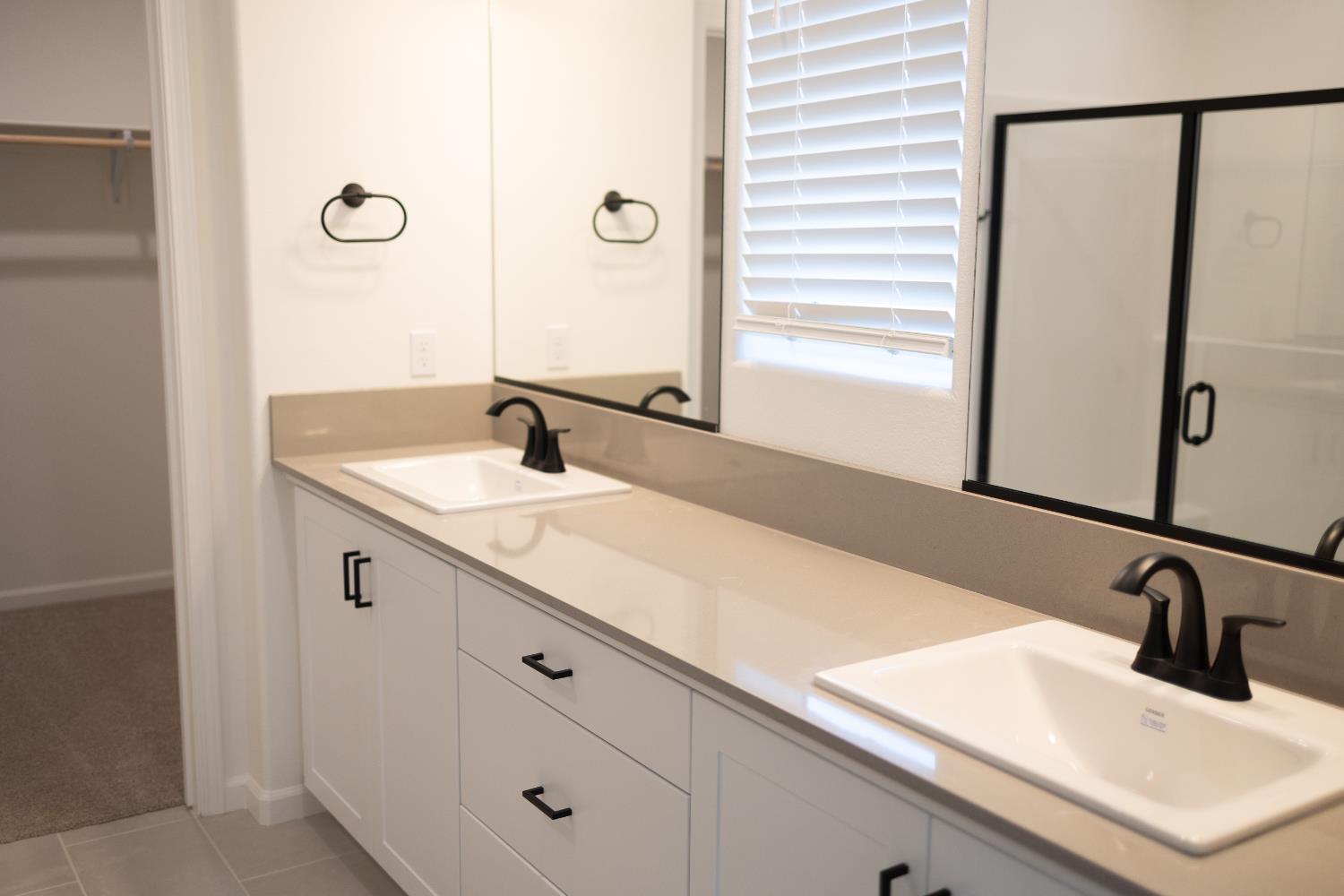696 Grace Way Madera, CA 93636 - Photo 6 of 19 a bathroom with a sink and a mirror