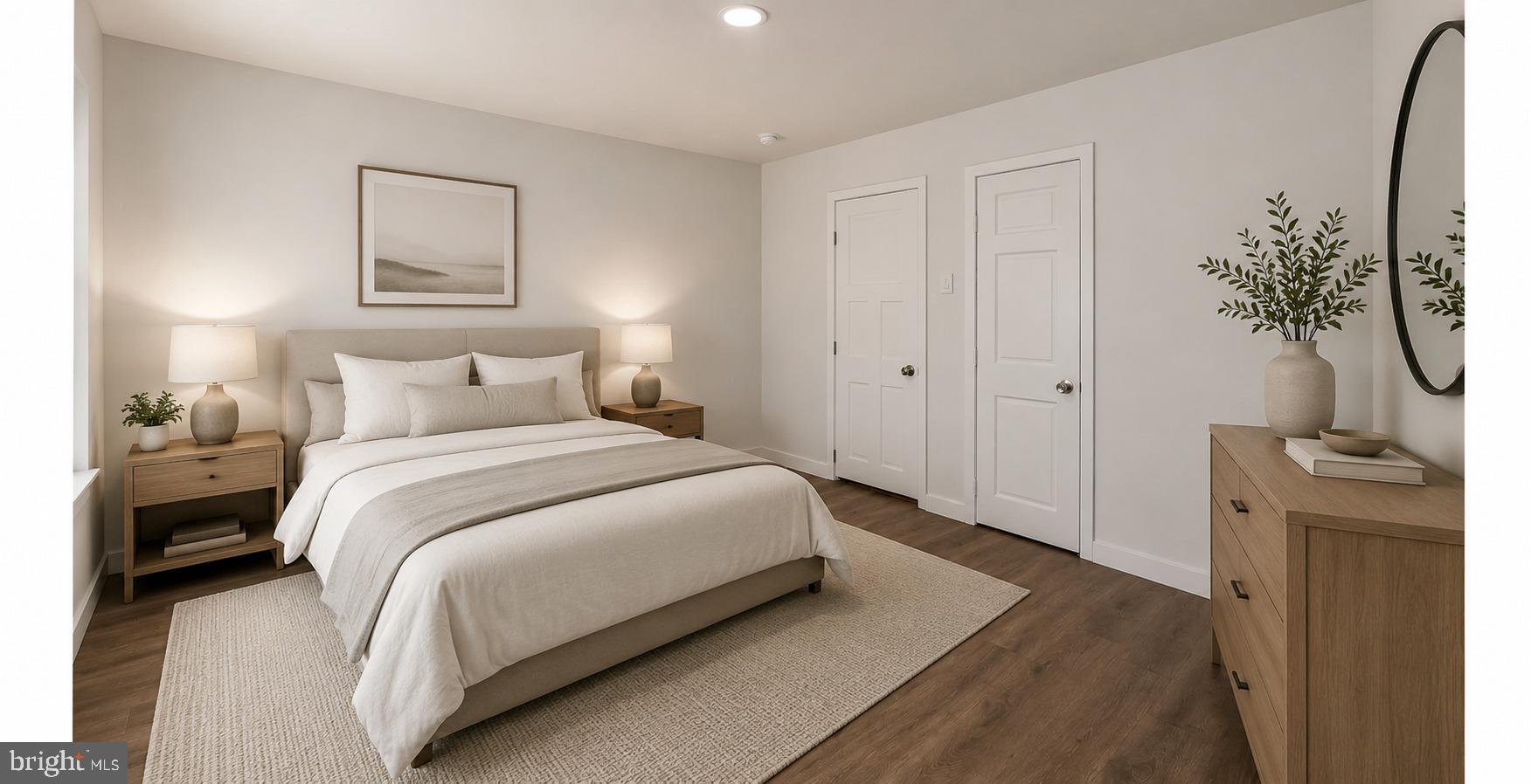 513 Manor Street Lancaster, PA 17603 - Photo 27 of 37 a bedroom with a bed and a potted plant