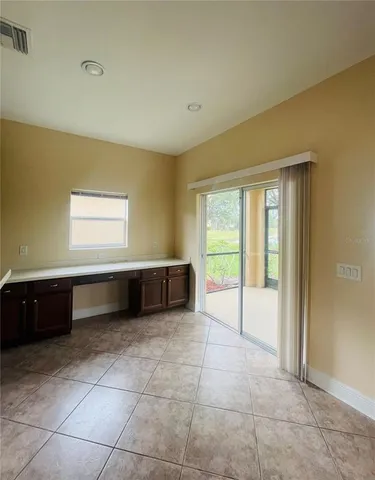 a room with a bed and window