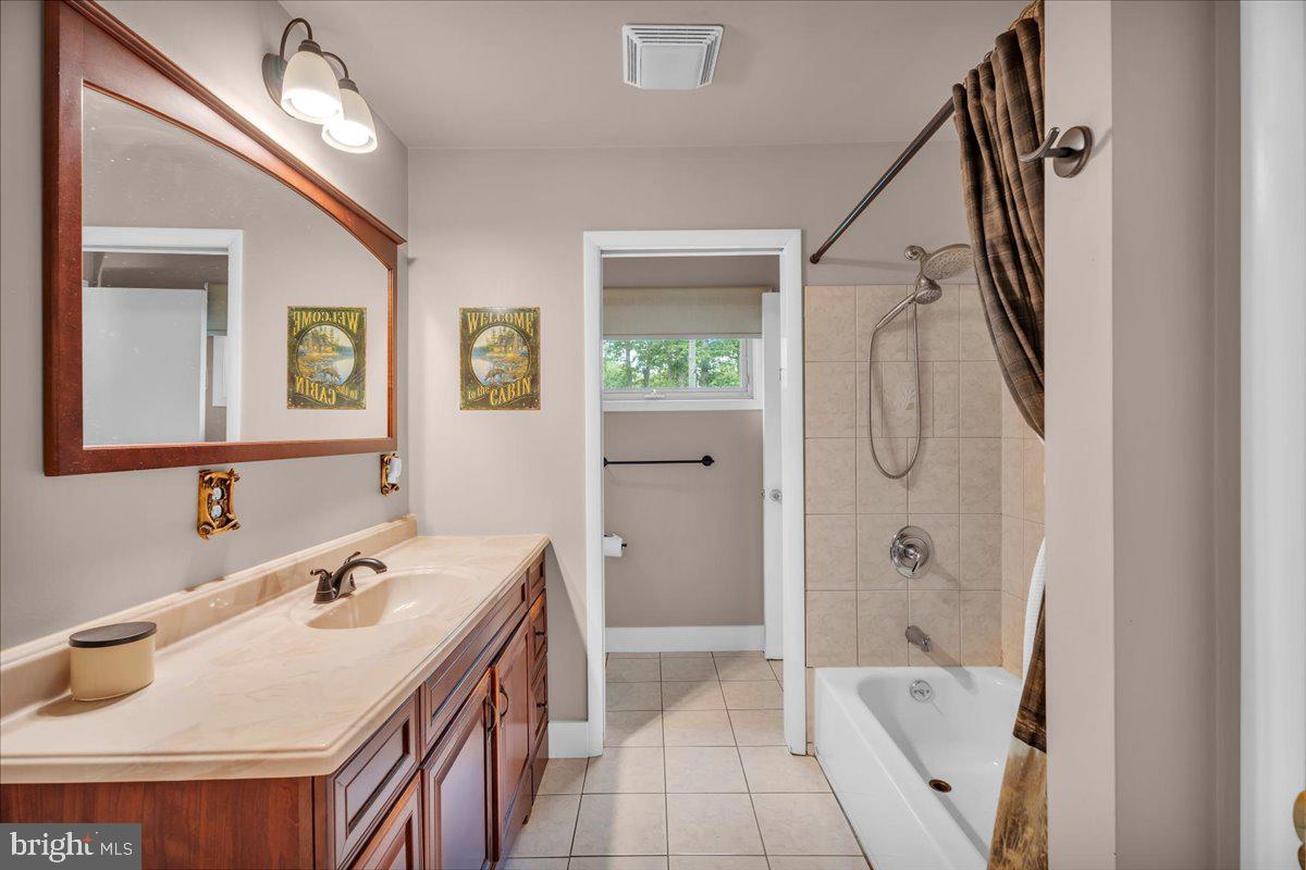 64 Blue Anchor Road Sicklerville, NJ 08081 - Photo 15 of 47 a bathroom with a tub sink and mirror