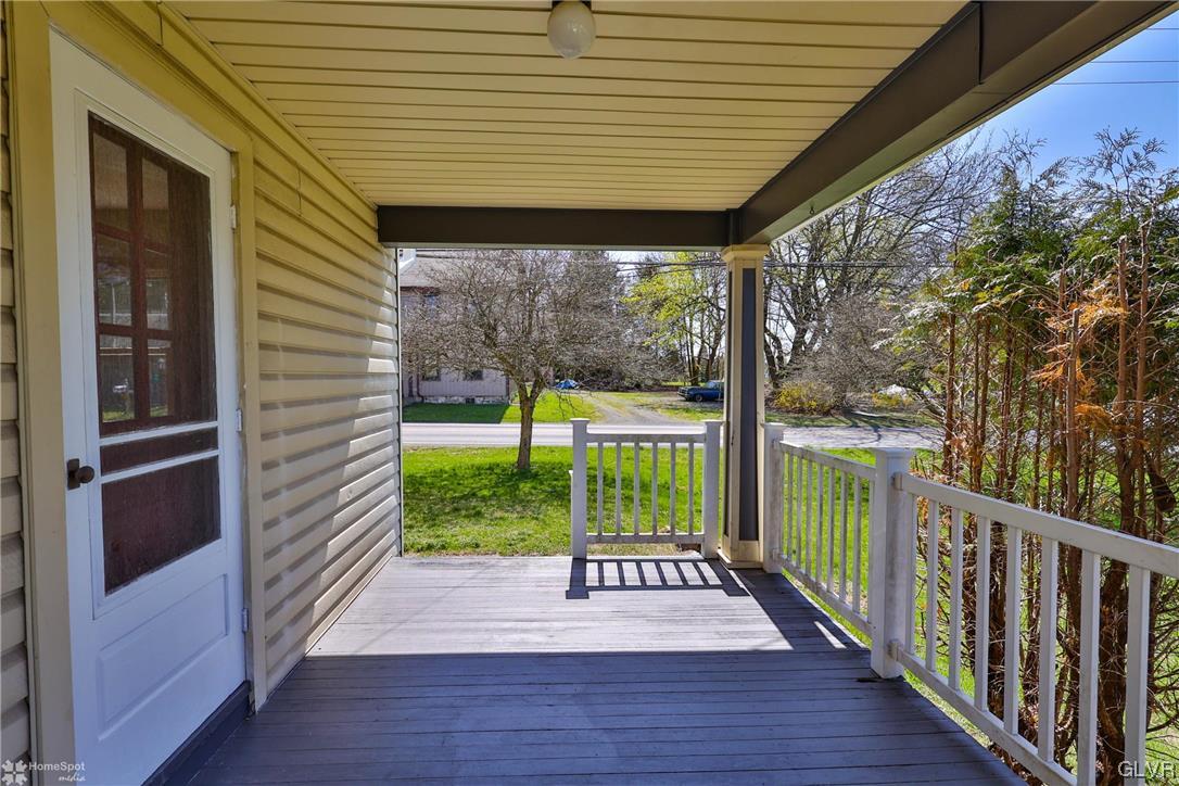 665 Point Phillips Road Bath, PA 18014 - Photo 4 of 39 a view of a porch with wooden floor and stairs