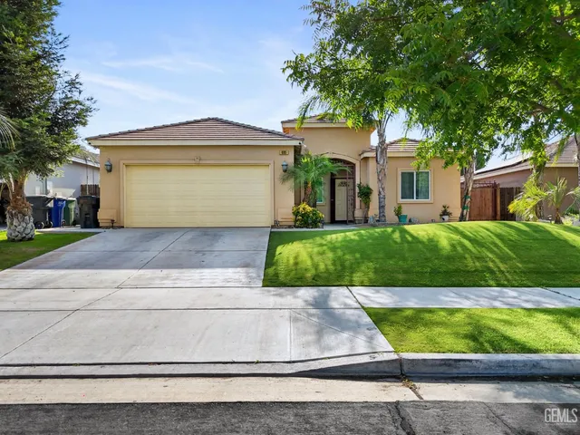 a view of a yard in front view of a house