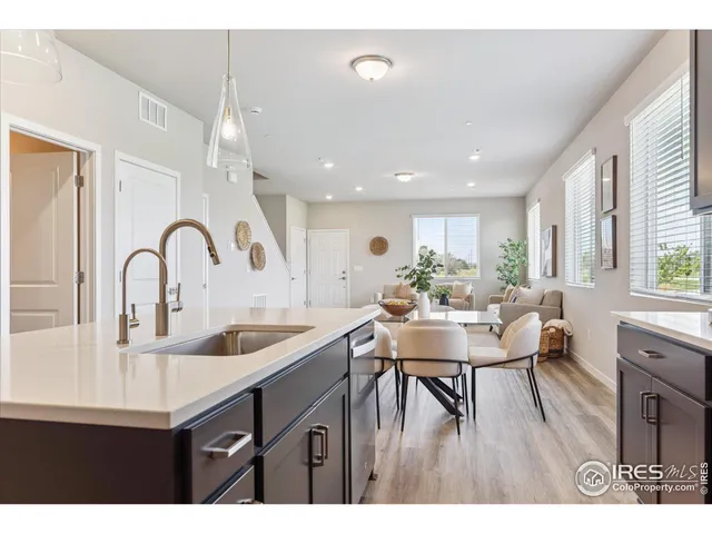 a kitchen with a table and chairs in it