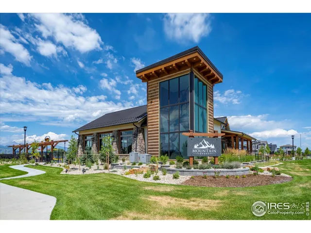 a view of a swimming pool with a table and chairs