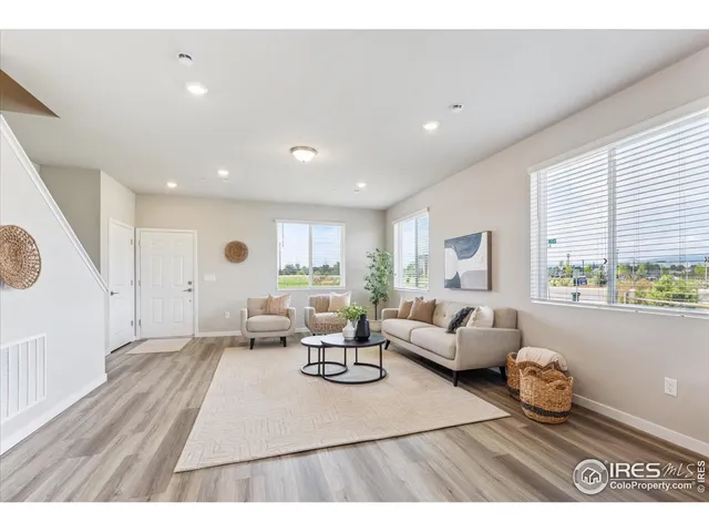 a living room with furniture and a table