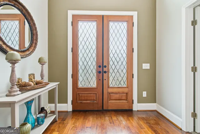 a view of front door with wooden floor