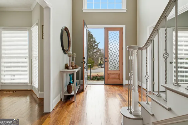 a view of a livingroom with furniture staircase and a fireplace