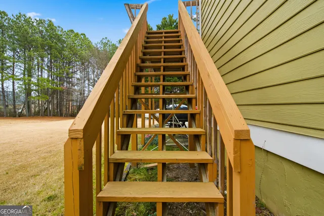 a view of a livingroom with a book shelf