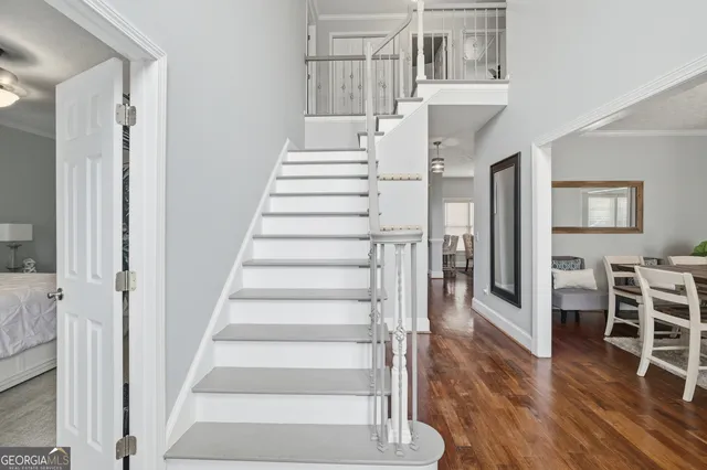 a view of a dining room with furniture and wooden floor