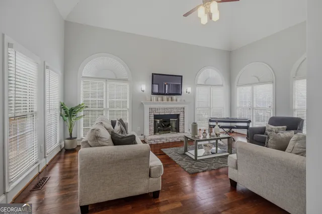a living room with furniture and a fireplace