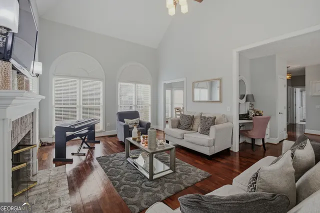 a dining room with furniture a rug and wooden floor