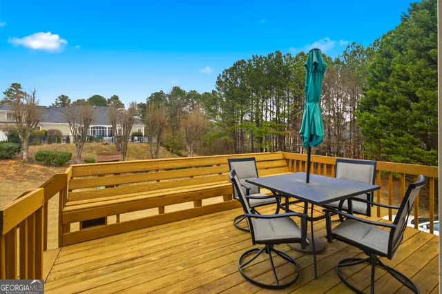 a view of a livingroom with furniture window and wooden floor