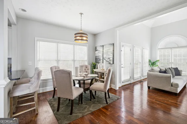a kitchen with stainless steel appliances granite countertop a sink a stove and a refrigerator