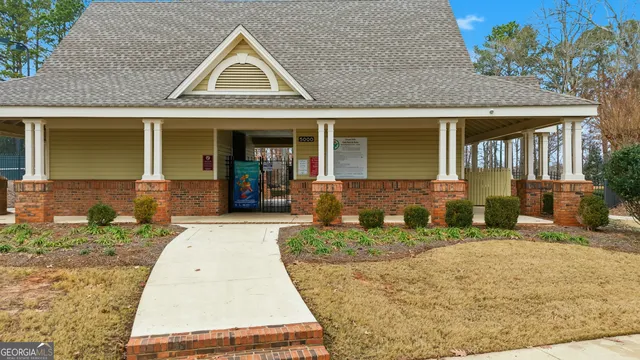 a picture of a wooden floor with a bench in living room