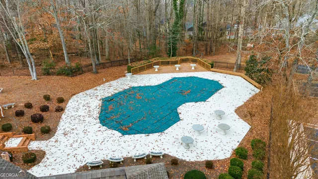 a view of a tennis ground with a chair