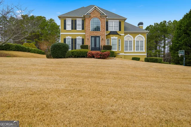 a front view of a house with a yard
