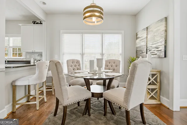 a view of a dining room with furniture window and outside view