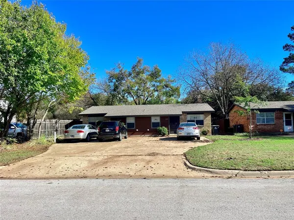a view of a cars park in front of house