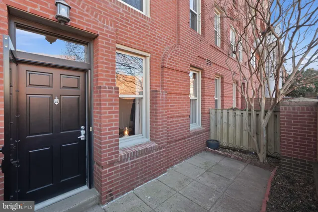a view of a brick house with a door