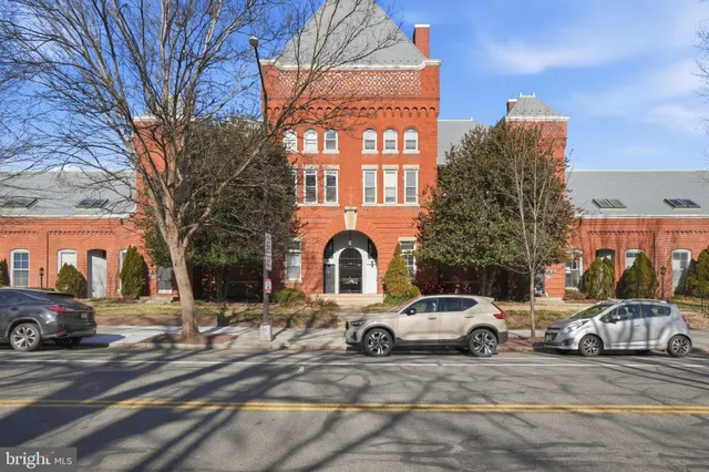 a view of a cars parked in front of a building