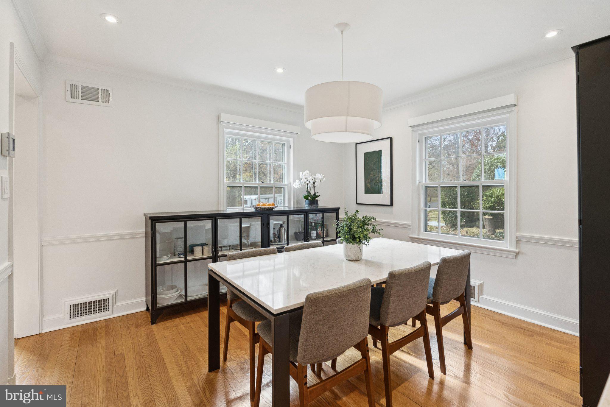 3231 Beech Street Northwest Washington, DC 20015 - Photo 8 of 29 a view of a dining room with furniture window and wooden floor