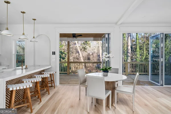 a dining room with furniture window wooden floor