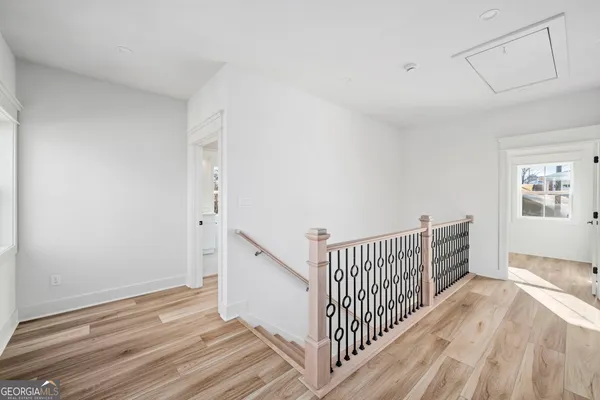 a bedroom with a bed and a chair