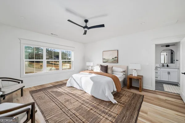 a bedroom with furniture and a window